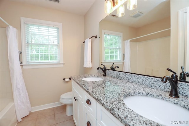 full bath featuring toilet, a wealth of natural light, visible vents, and a sink