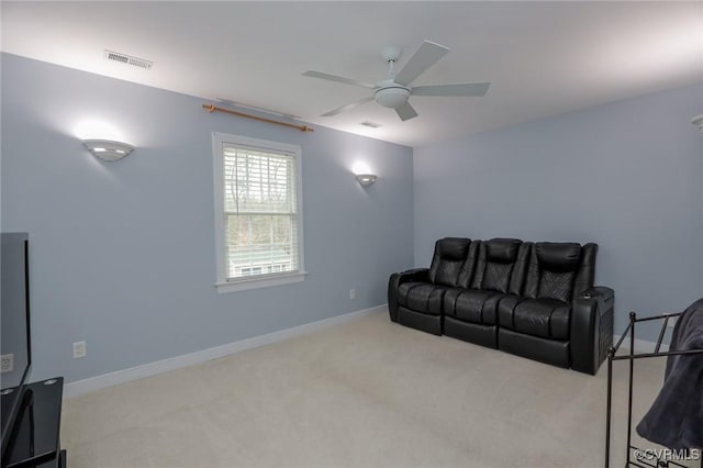 carpeted living area with ceiling fan, visible vents, and baseboards