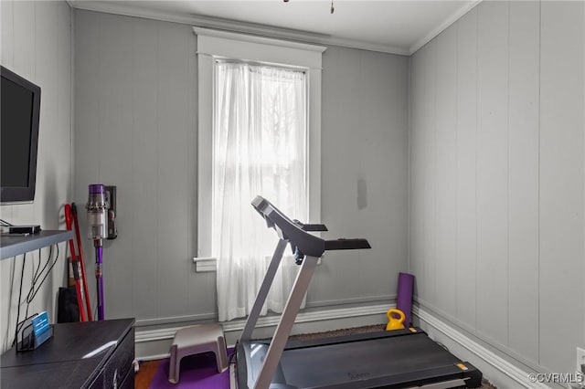 exercise room with ornamental molding