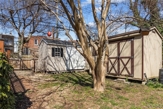 view of shed with a gate and fence