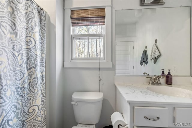 bathroom with vanity and toilet