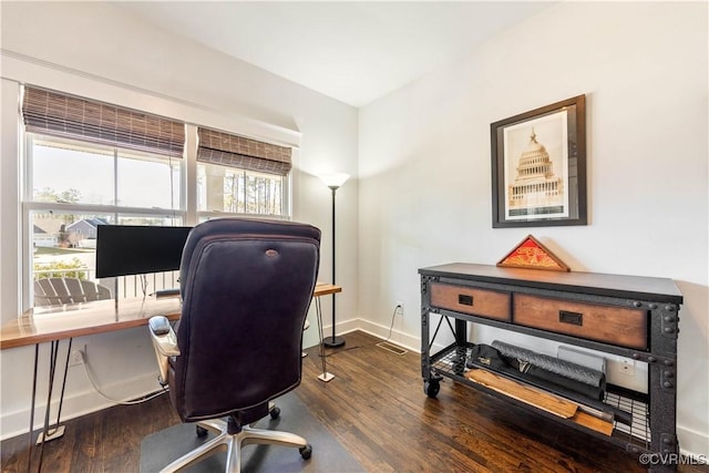 office featuring baseboards and wood finished floors