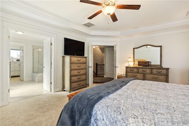 bedroom featuring carpet, crown molding, visible vents, ensuite bathroom, and ceiling fan