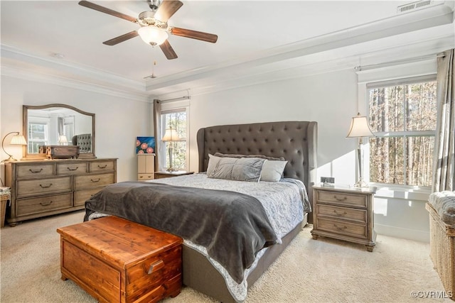 bedroom with light carpet, crown molding, visible vents, and ceiling fan