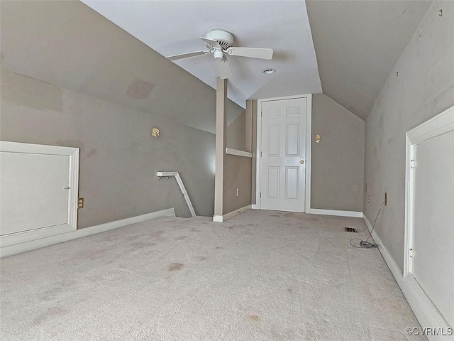 bonus room with vaulted ceiling, ceiling fan, carpet flooring, and baseboards