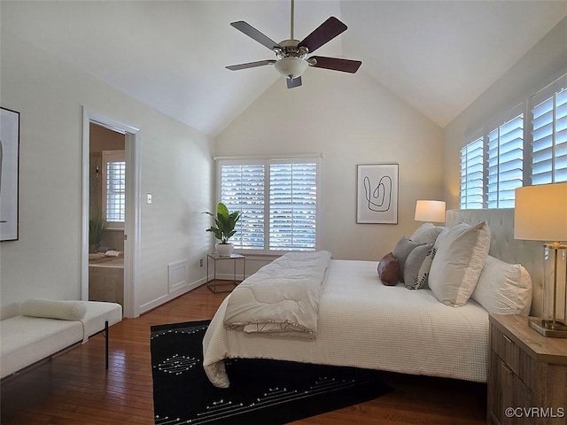 bedroom with lofted ceiling, multiple windows, ceiling fan, and wood finished floors