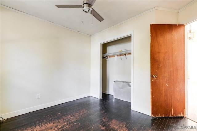 unfurnished bedroom with baseboards, a closet, ornamental molding, and wood finished floors