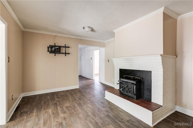 unfurnished living room with crown molding, baseboards, and wood finished floors