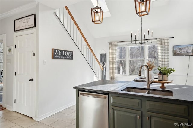 kitchen featuring light tile patterned floors, stainless steel dishwasher, dark stone countertops, and a sink