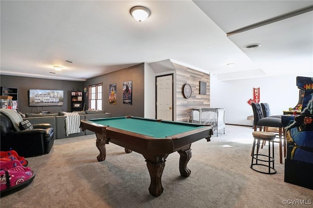 game room featuring carpet, pool table, visible vents, an accent wall, and wood walls