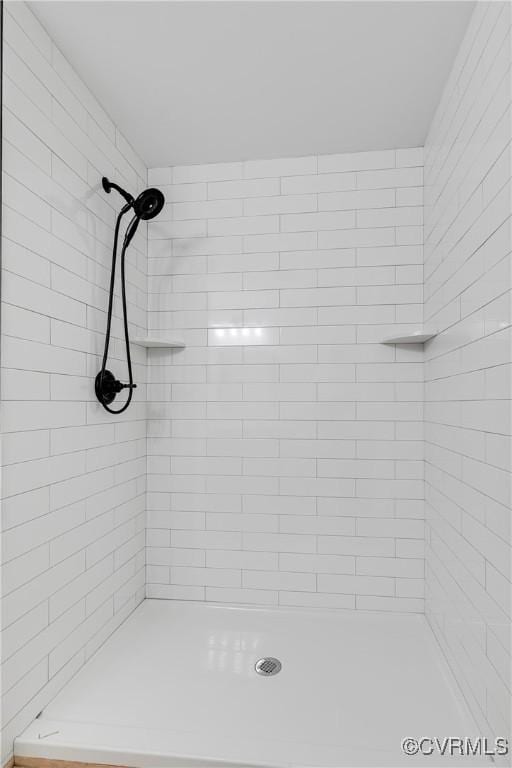 bathroom with tiled shower