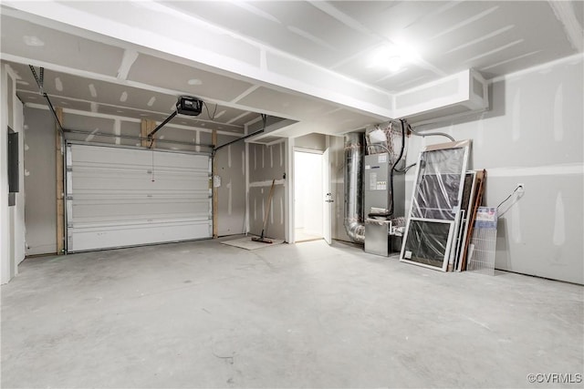 garage with a garage door opener and heating unit