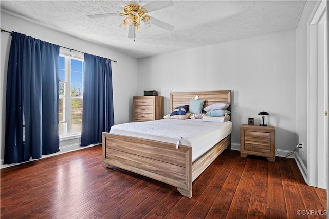 bedroom featuring baseboards, a textured ceiling, a ceiling fan, and hardwood / wood-style flooring