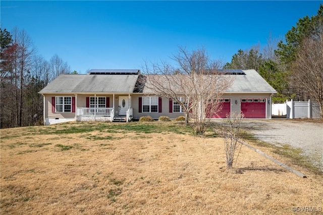 ranch-style home with fence, a porch, a garage, crawl space, and driveway