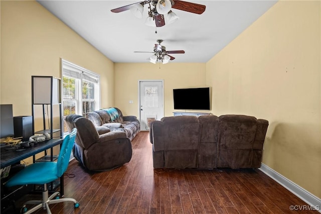 living area with baseboards, a ceiling fan, and wood finished floors