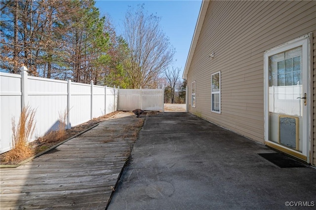 view of patio featuring fence