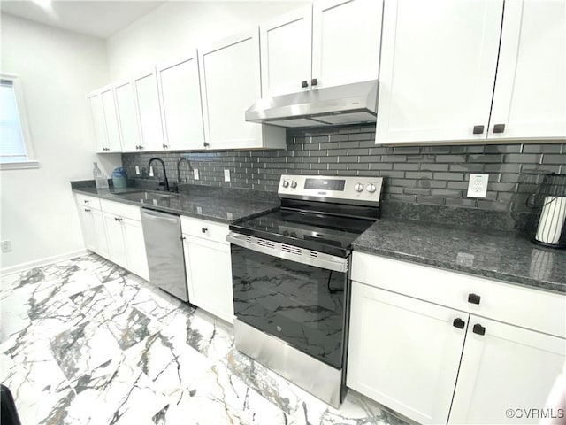 kitchen featuring under cabinet range hood, stainless steel appliances, white cabinets, marble finish floor, and backsplash