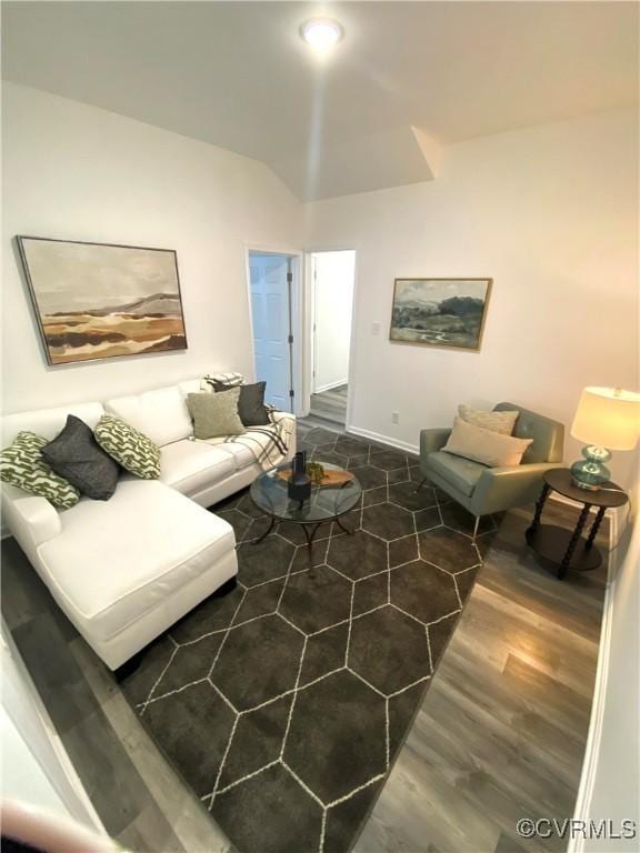 living room with dark wood finished floors and baseboards