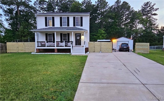 view of front of house with an outbuilding, a gate, a porch, a front lawn, and a garage