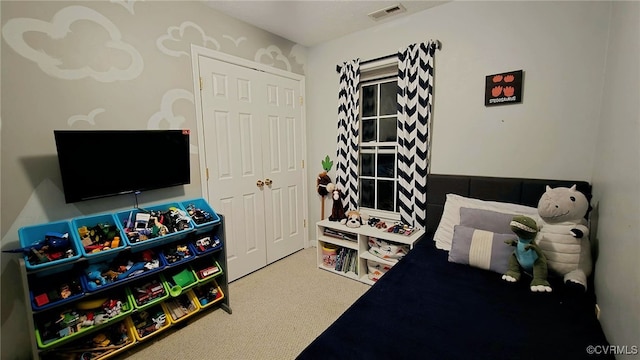 bedroom with visible vents and carpet floors