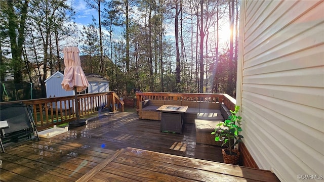 wooden terrace with a fire pit