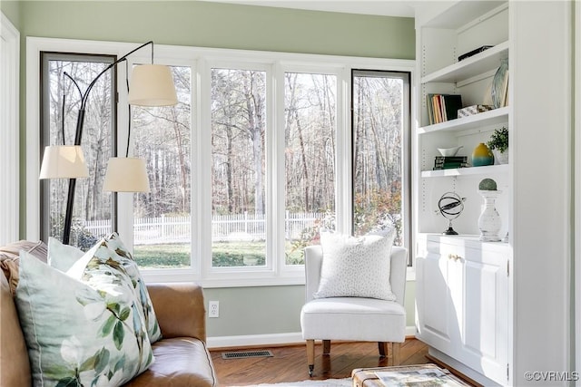 sunroom / solarium with plenty of natural light and visible vents