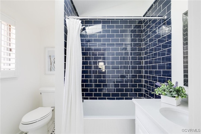 bathroom with vanity, toilet, and shower / tub combo with curtain