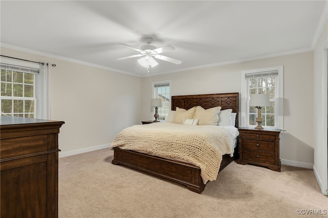 bedroom with light carpet, baseboards, and multiple windows