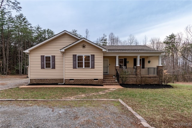 ranch-style house with covered porch, crawl space, and a front yard