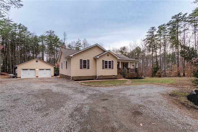 view of front facade featuring a shingled roof, a detached garage, crawl space, an outdoor structure, and a porch