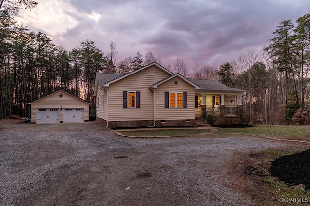 view of front of house with crawl space, an outdoor structure, and a detached garage