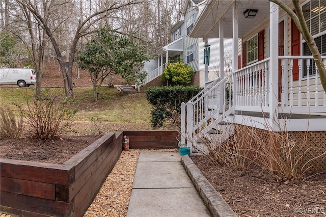 view of side of property with a porch