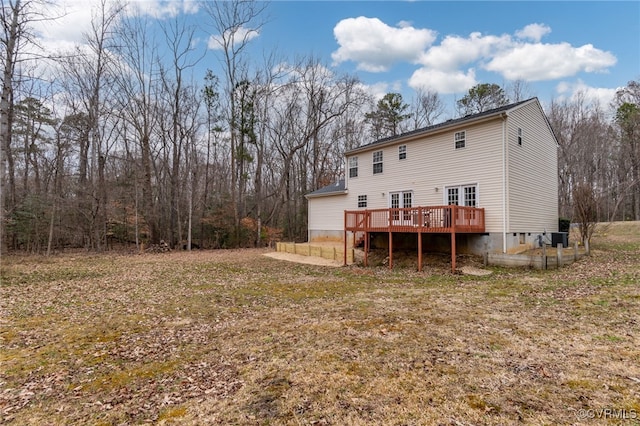 back of house featuring a wooden deck