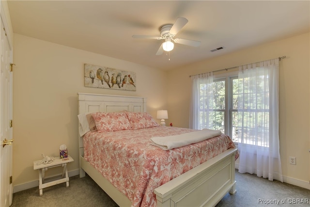 bedroom with a ceiling fan, light carpet, visible vents, and baseboards