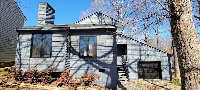 view of side of property featuring a chimney