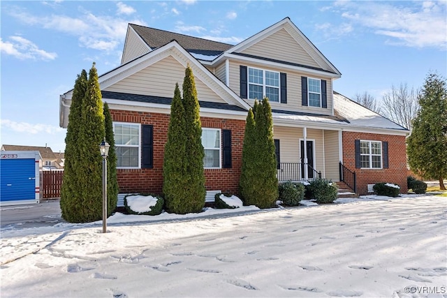 view of front of property with a porch and brick siding