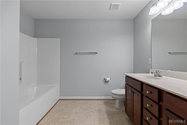 full bath featuring toilet, vanity, visible vents, baseboards, and washtub / shower combination