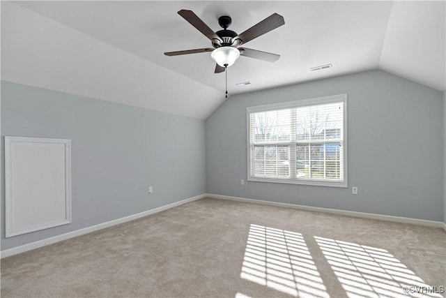 bonus room featuring visible vents, vaulted ceiling, and baseboards