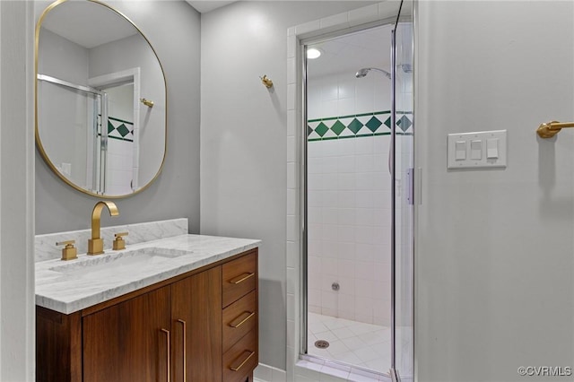 full bathroom with a stall shower and vanity