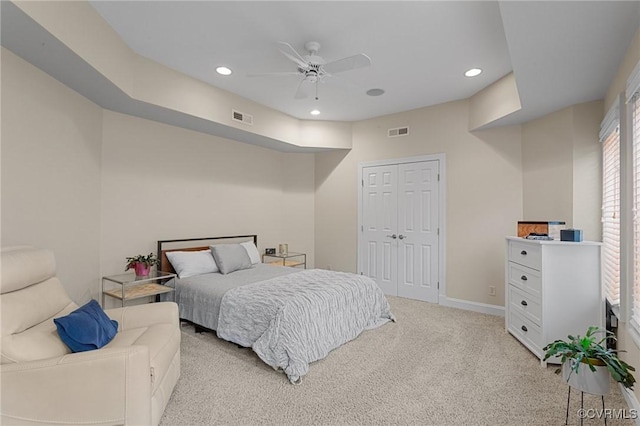 bedroom featuring light colored carpet, visible vents, and recessed lighting