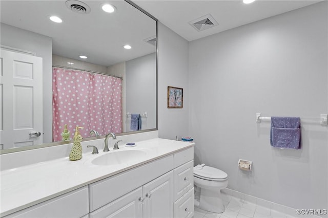 bathroom with toilet, vanity, visible vents, and recessed lighting