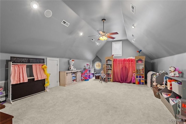 playroom featuring lofted ceiling, a ceiling fan, visible vents, and carpet flooring