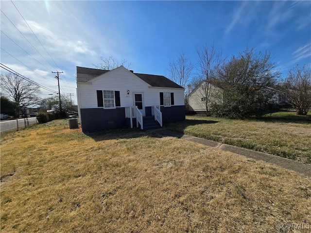 view of front of property with a front yard and fence