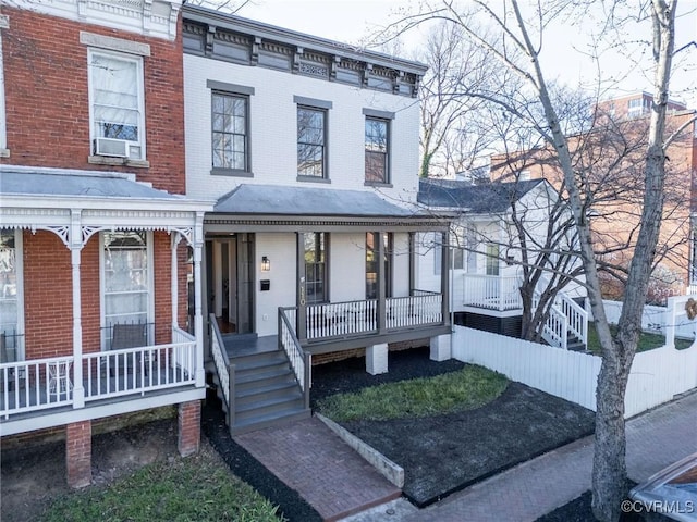110 S Pine St, Richmond, VA 23220 - view of front facade with a porch, brick siding, and cooling unit
