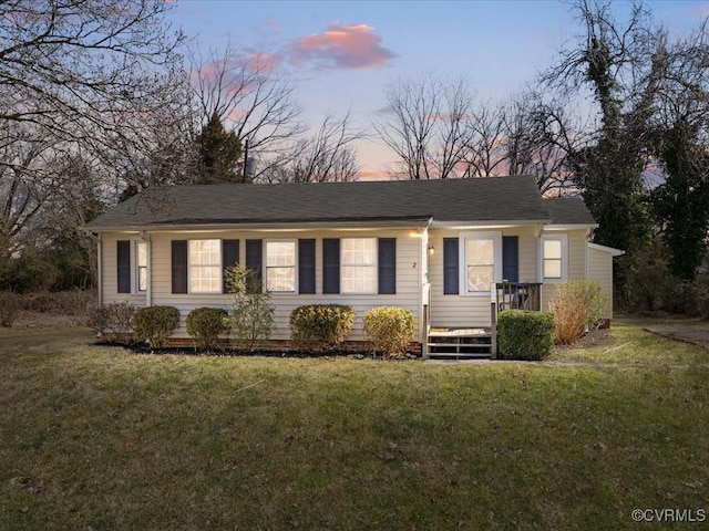 single story home featuring a front yard