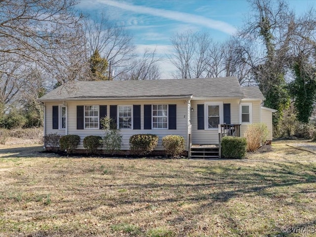 single story home featuring a front yard