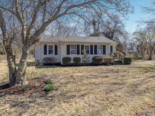 single story home featuring a front yard