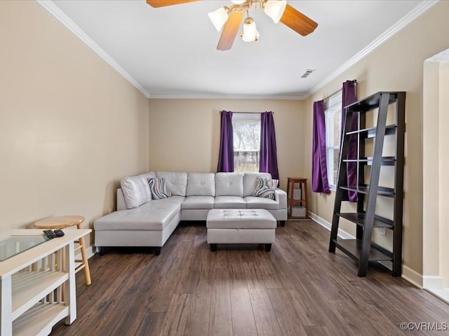 living area with crown molding, visible vents, baseboards, and dark wood-style flooring