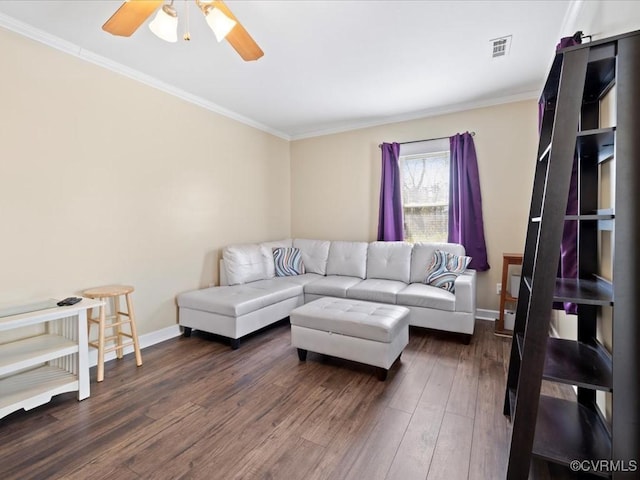 living room with ornamental molding, dark wood-style flooring, and visible vents