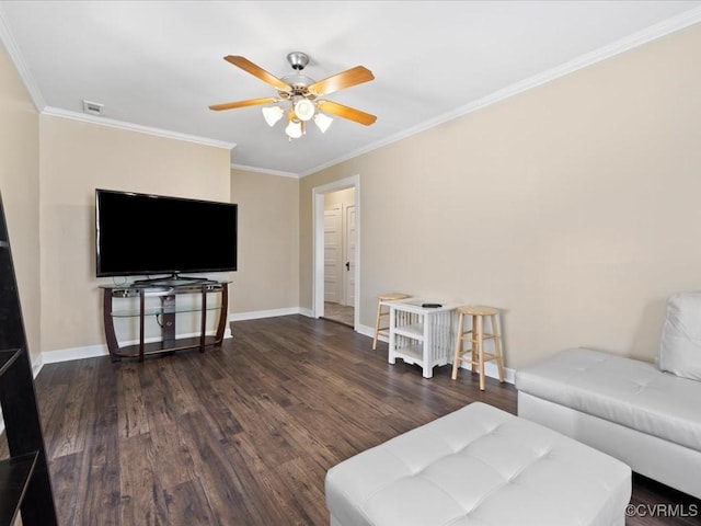 living room featuring visible vents, baseboards, ceiling fan, wood finished floors, and crown molding